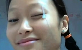 pigtailed-asian-teen-gets-her-pretty-face-covered-in-cum
