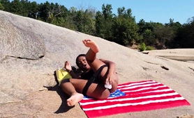 curvaceous-black-babe-making-her-pussy-squirt-on-the-beach