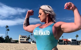 muscle-blonde-milf-flaunts-amazing-curves-on-the-beach
