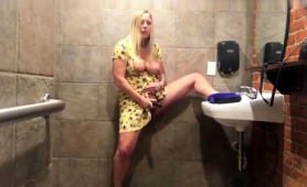 Buxom Amateur Milf Pleases Her Fiery Cunt In A Public Toilet